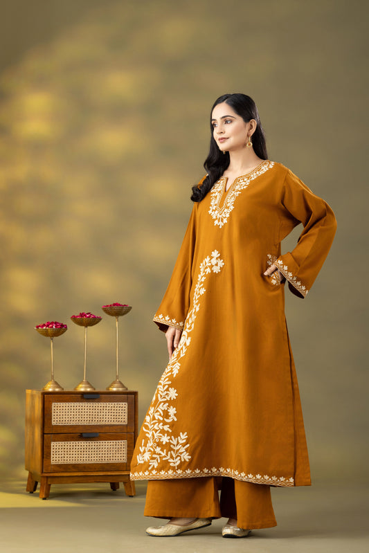 mustard phiran set, phiran dress of kashmir, mustard phiran set kashmiri, phiran kurta set, kashmiri phiran female, mustard phiran set online shopping kashmiri phiran female, kashmiri phiran female online, phiran dress of kashmir men, kashmiri phiran female woolen, kashmir box phiran
premium mustard woolen phiran set for women, handcrafted Kashmiri phiran with Aari embroidery, festive winter mustard phiran set, elegant honey mustard woolen phiran for casual and party wear